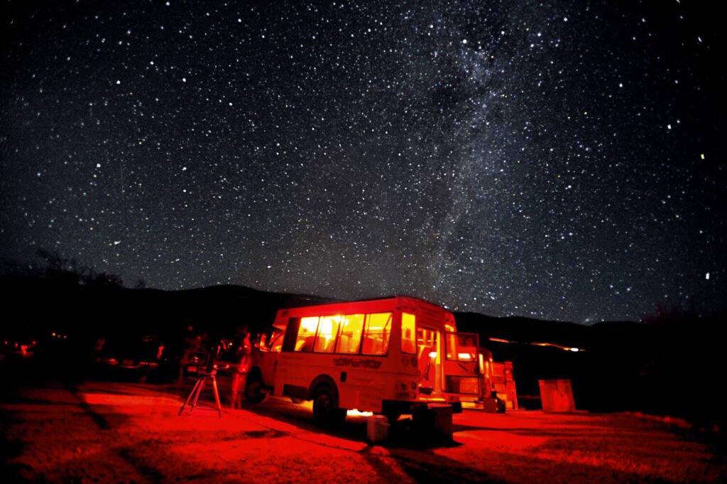people camping under the night sky of Mauna Kea, Hawaii